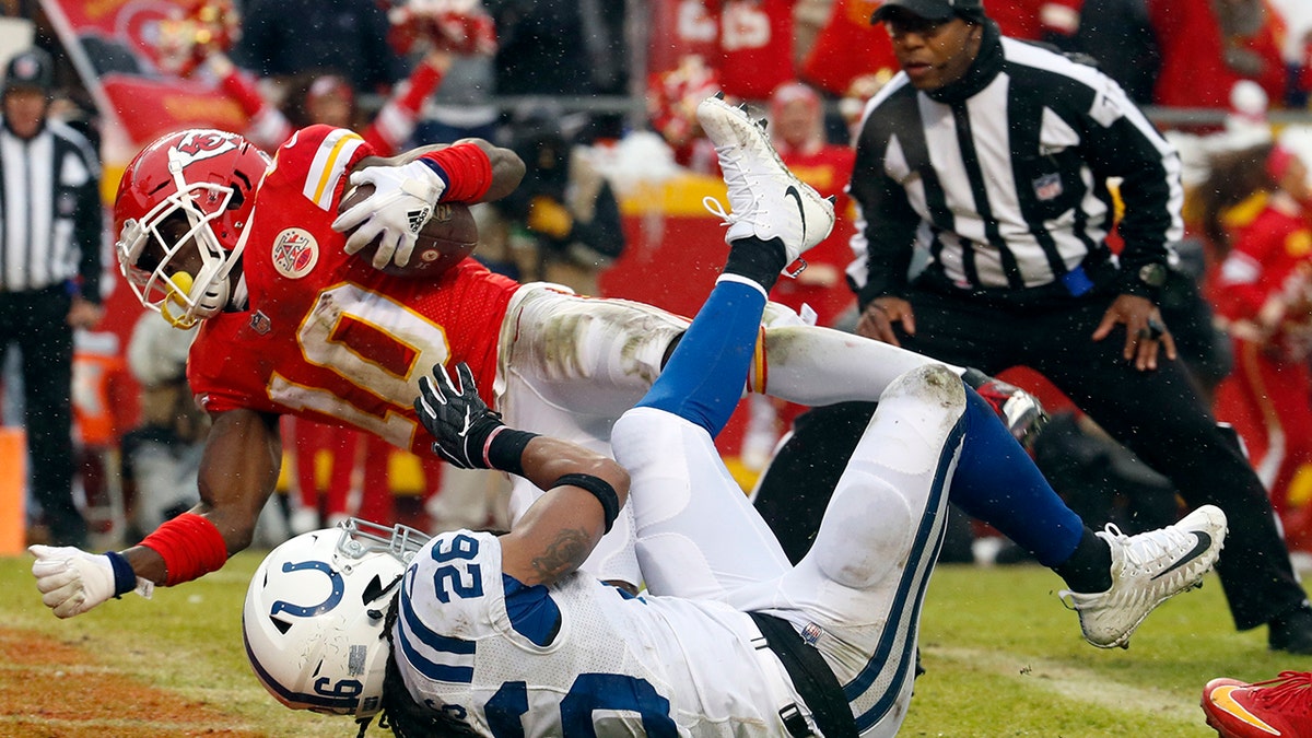 Kansas City Chiefs wide receiver Tyreek Hill (10) scores a touchdown past Indianapolis Colts safety Clayton Geathers (26) during the first half of an NFL divisional football playoff game in Kansas City, Mo., Saturday, Jan. 12, 2019. (Associated Press)