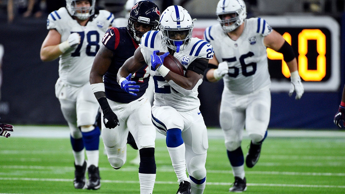 Indianapolis Colts running back Marlon Mack (25) runs against the Houston Texans during the second half of an NFL wild card playoff football game, Saturday, Jan. 5, 2019, in Houston. (Associated Press)