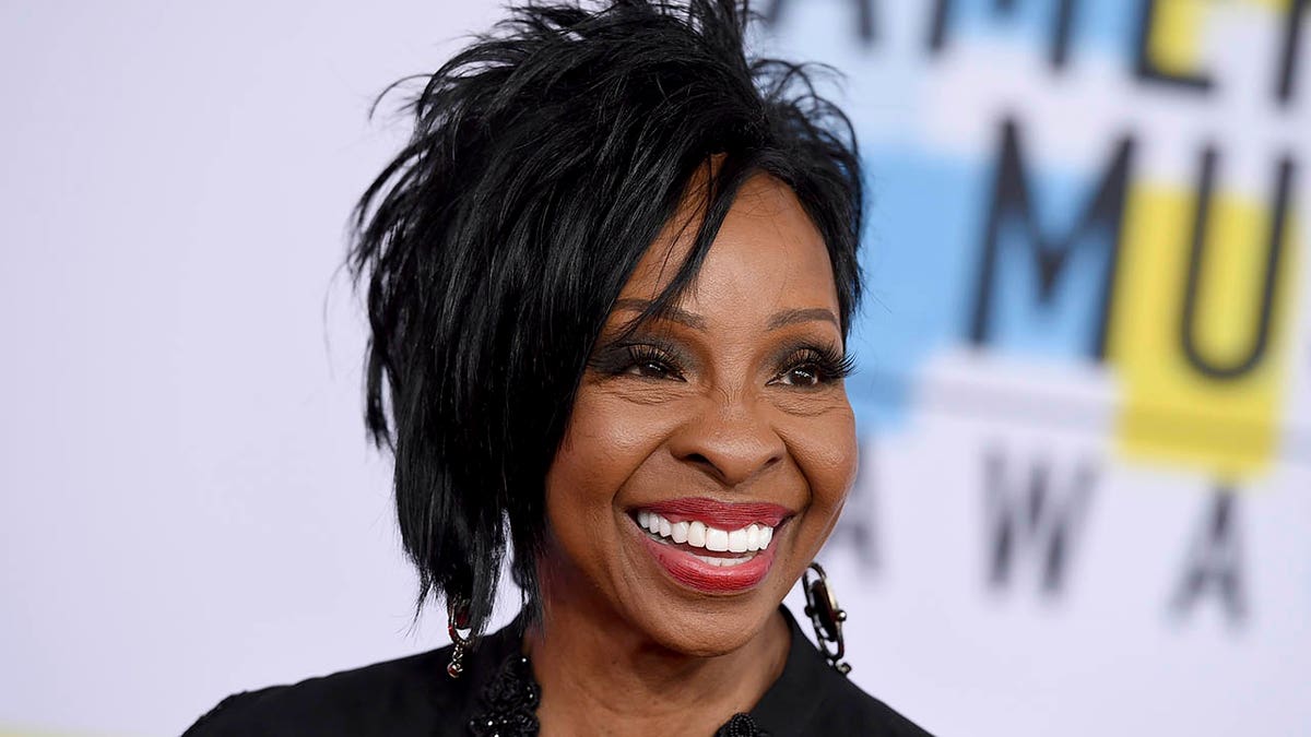 FILE - In this Oct. 9, 2018 file photo, Gladys Knight arrives at the American Music Awards at the Microsoft Theater in Los Angeles. The seven-time Grammy Award-winner will sing “The Star-Spangled Banner” at this year’s Super Bowl, Sunday, Feb. 3, 2019.  Knight says she’s proud to use her voice to “unite and represent our country” in her hometown of Atlanta.(Photo by Jordan Strauss/Invision/AP, File)