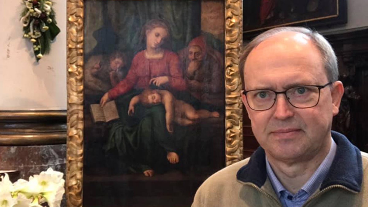 Pastor Jan Van Raemdonck (pictured) had recently given the painting a more prominent position in the church while waiting for an Italian art expert to authenticate the piece.