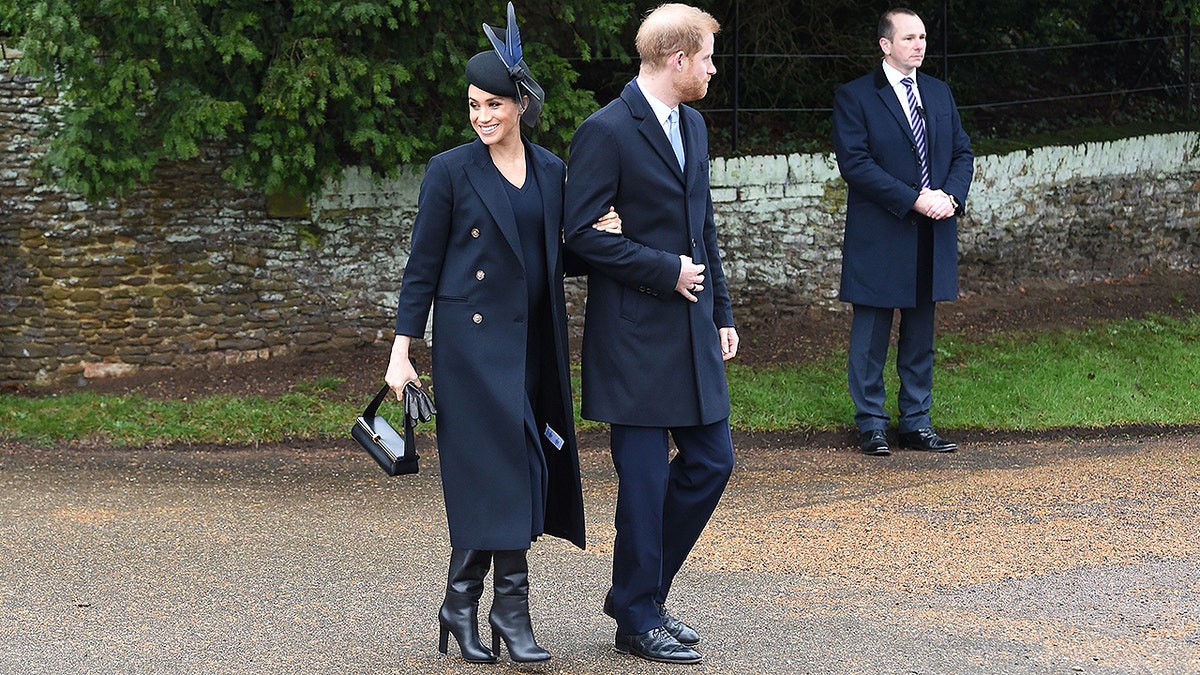 Meghan, Duchess of Sussex and Britain's Prince Harry, Duke of Sussex,   depart after the Royal Family's traditional Christmas Day service at St Mary Magdalene Church in Sandringham, Norfolk, eastern England, on December 25, 2018. (Photo by Paul ELLIS / AFP)        (Photo credit should read PAUL ELLIS/AFP/Getty Images)