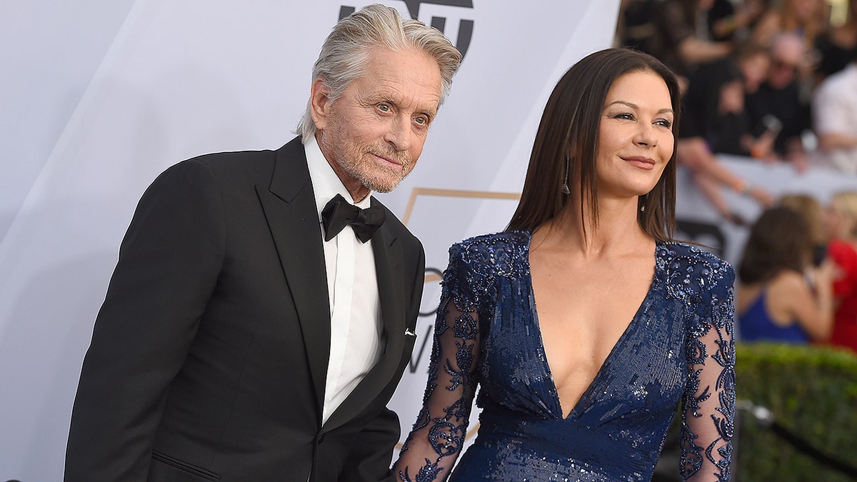 Michael Douglas, left, and Catherine Zeta-Jones arrive at the 25th annual Screen Actors Guild Awards at the Shrine Auditorium & Expo Hall on Sunday, Jan. 27, 2019, in Los Angeles. (Photo by Jordan Strauss/Invision/AP)