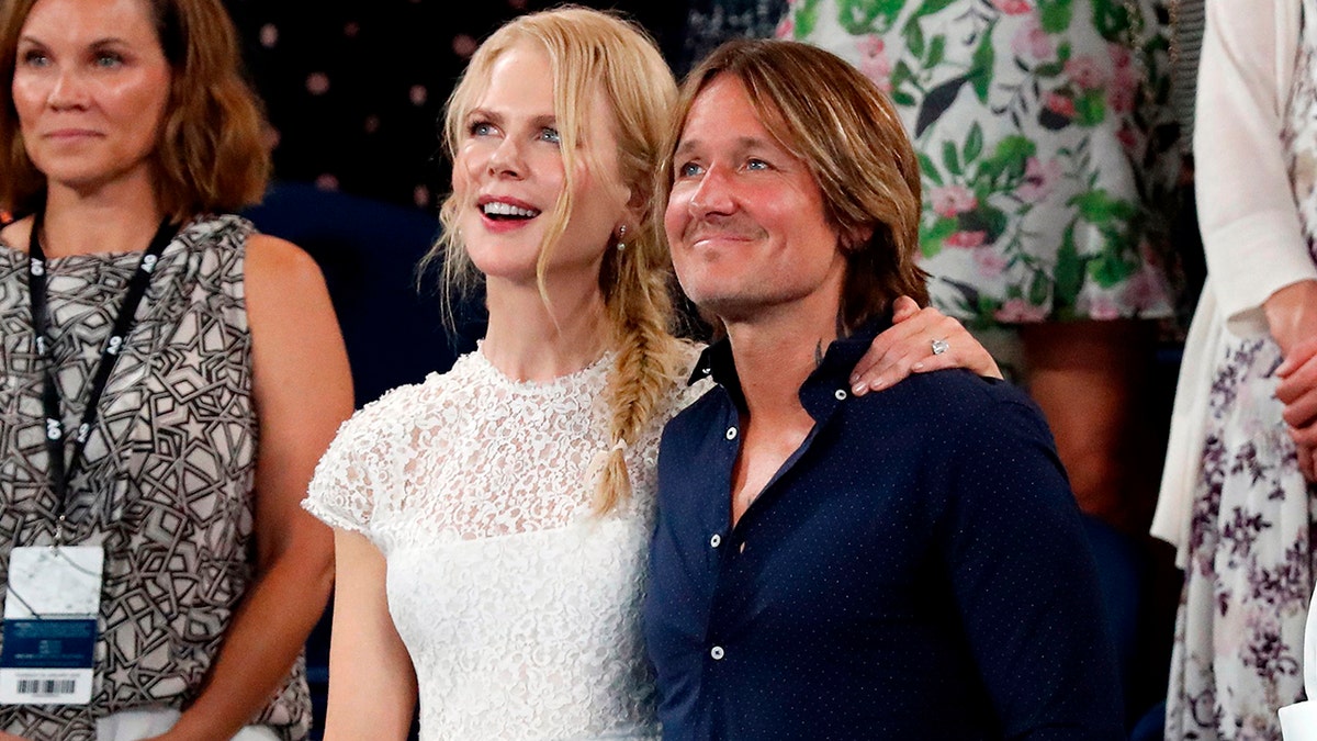 Australian actress Nicole Kidman, husband singer Keith Urban (C) and Australia's former foreign minister Julie Bishop watch the women's singles semi-final match between Czech Republic's Petra Kvitova and Danielle Collins of the US on day 11 of the Australian Open tennis tournament in Melbourne on January 24, 2019. (Photo by DAVID GRAY / AFP) / -- IMAGE RESTRICTED TO EDITORIAL USE - STRICTLY NO COMMERCIAL USE --        (Photo credit should read DAVID GRAY/AFP/Getty Images)