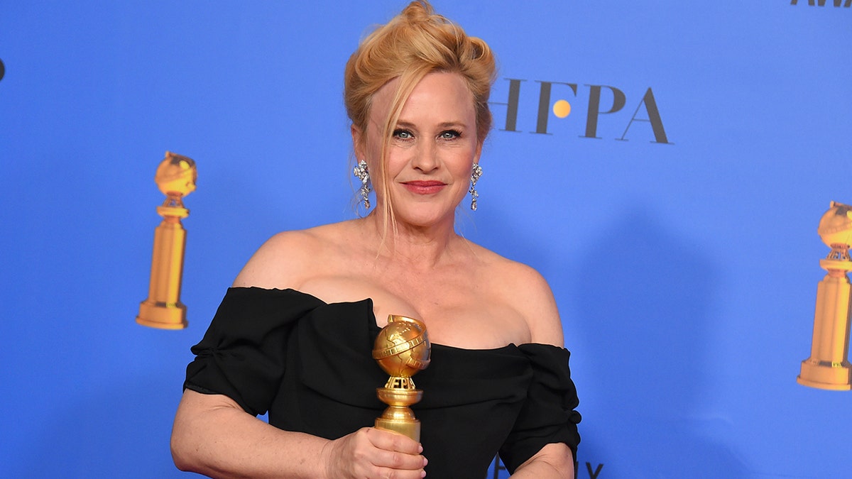 Patricia Arquette poses in the press room with the award for best performance by an actress in a limited series or a motion picture made for television for 