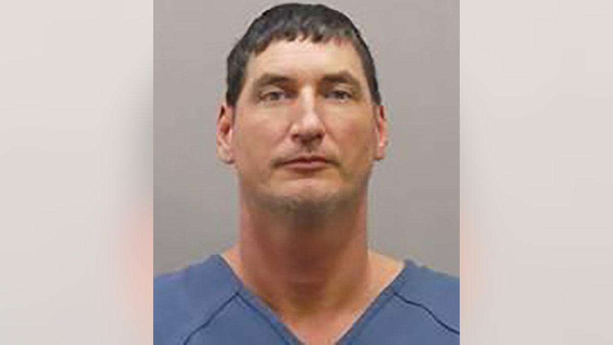 Paul Hicks, 43, turned himself in to authorities in Ohio on Wednesday for allegedly masterminding an 'elaborate' arson scheme intended to frame his ex-girlfriend, police said.