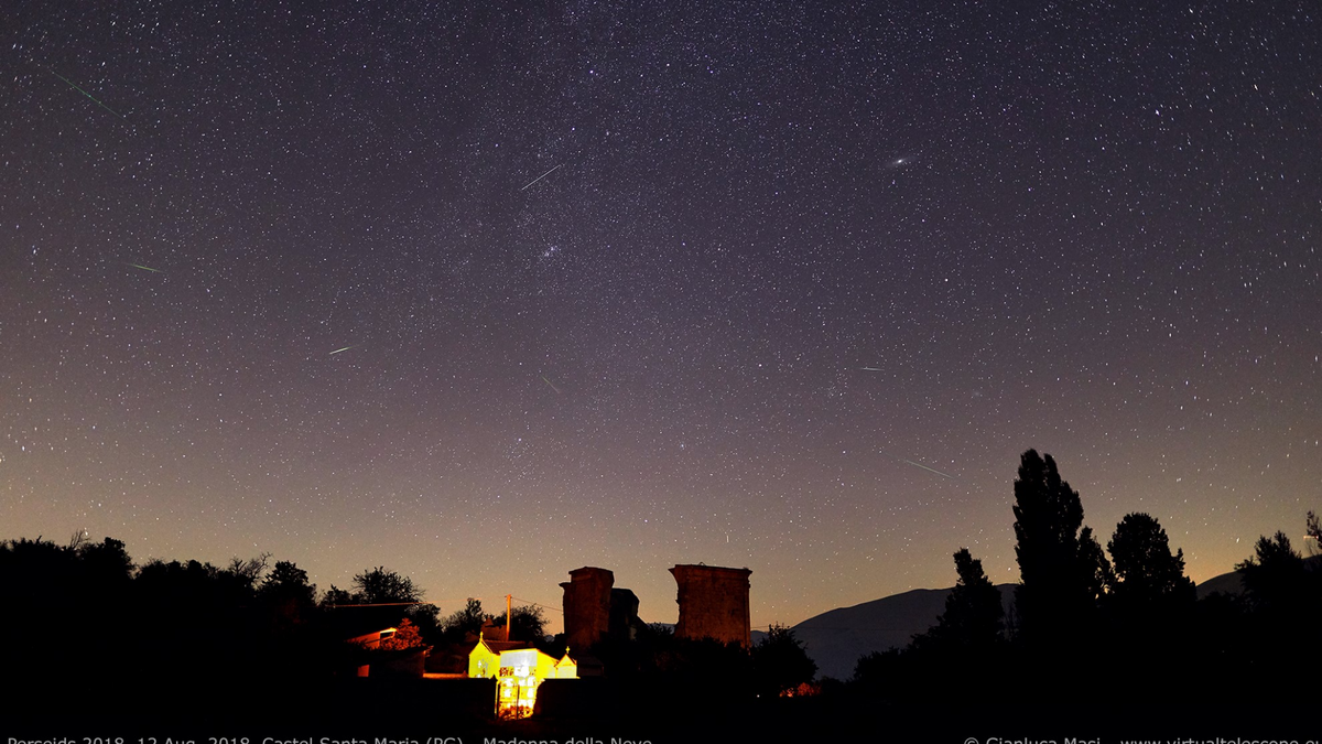 Several Perseid meteors dash across the sky above Italy's Castel Santa Maria in this photo by astrophysicist Gianluca Masi of the Virtual Telescope Project taken during the peak on Aug. 12-13, 2018.