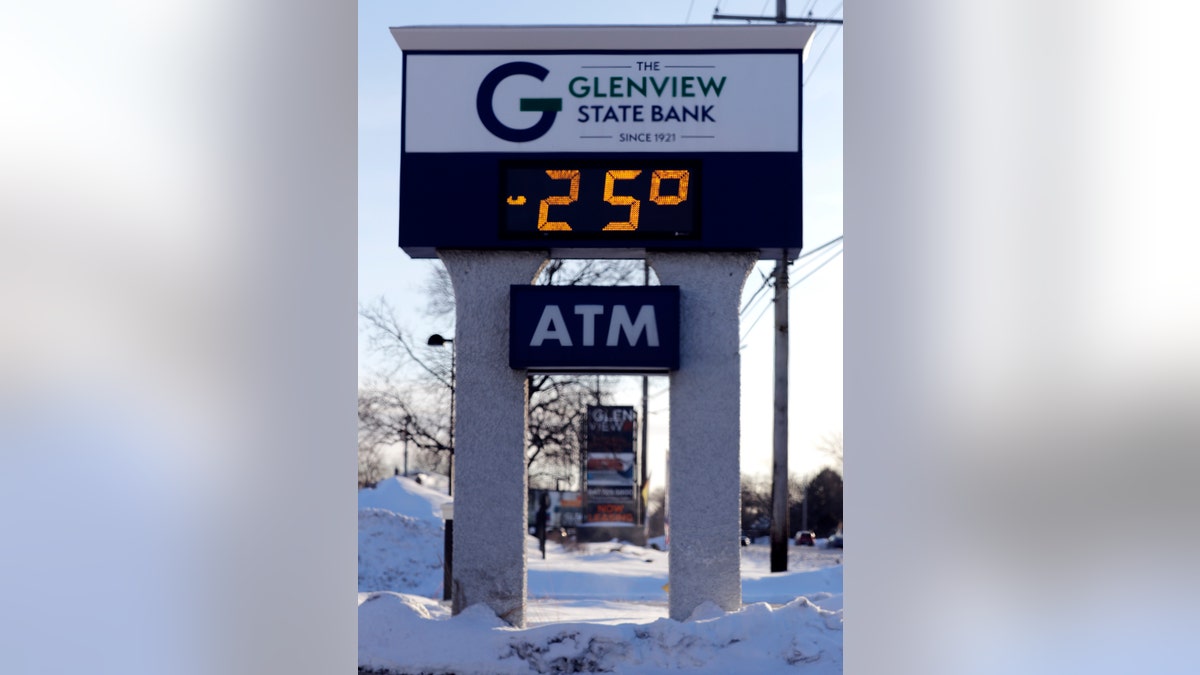 A sign shows the current outdoor temperature in Glenview, Ill., Wednesday, Jan. 30, 2019.