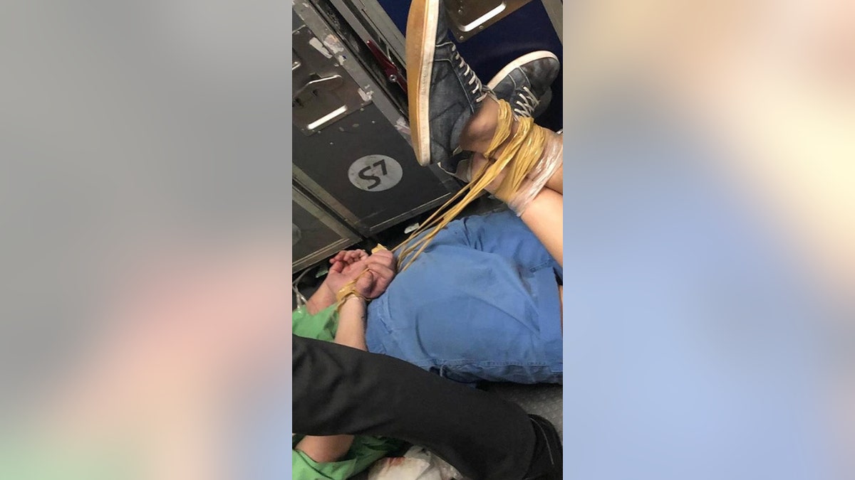 An unruly passenger on an S7 flight had to be hog-tied after getting drunk and behaving inappropriately.