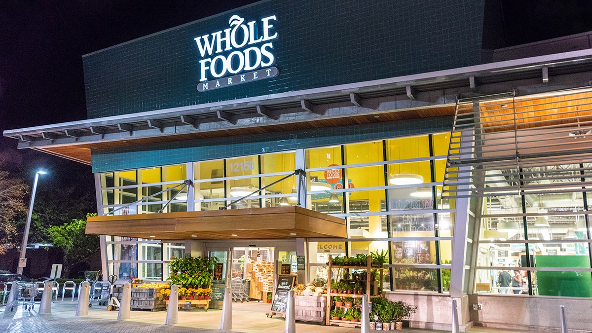 North Miami's Whole Foods Market Facade at night. Whole Foods is an American foods supermarket chain specializing in natural and organic foods. It opened on Sept. 20, 1980, in Austin, Texas, its current headquarters. It is owned by Amazon.com