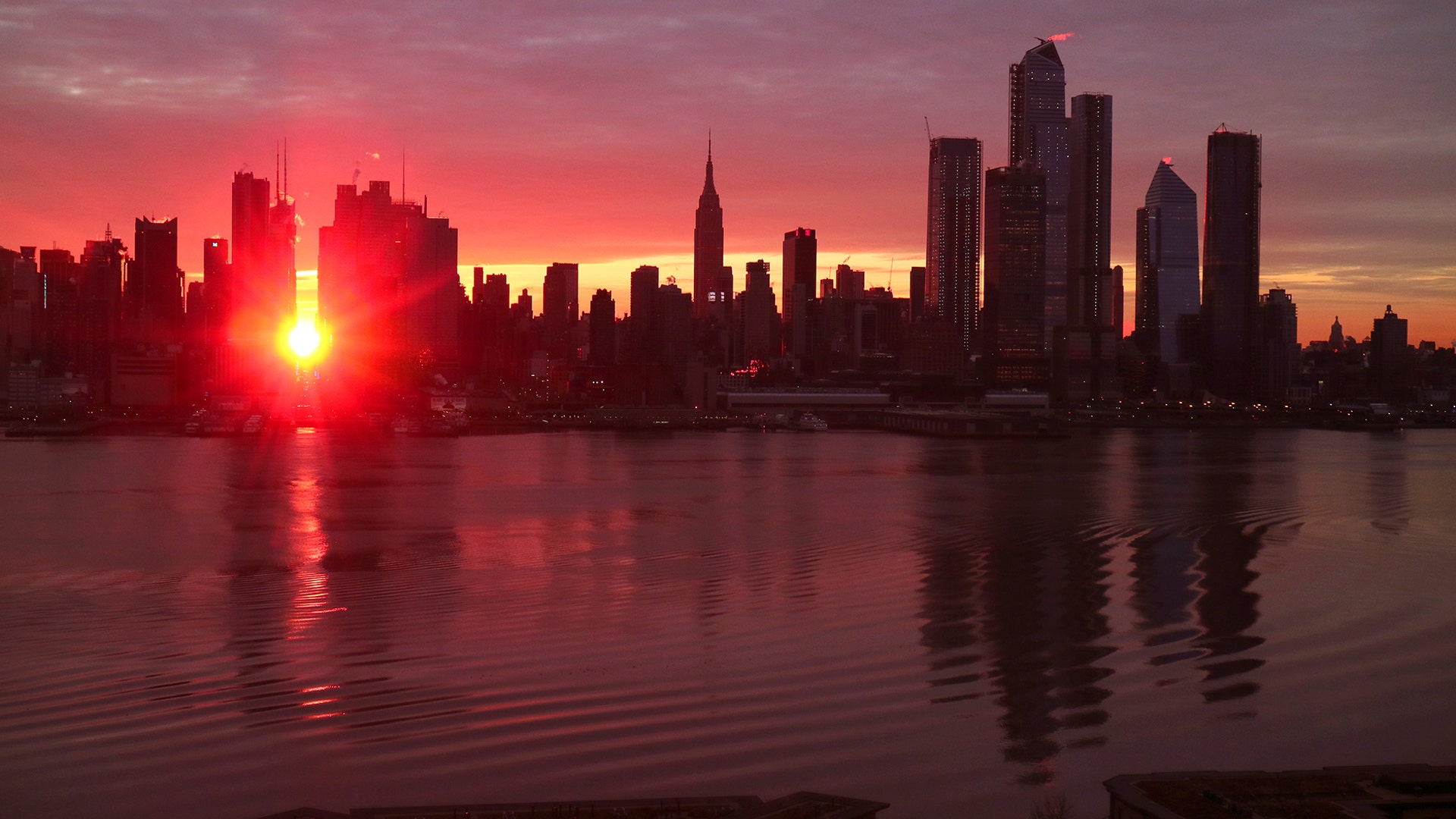 The sun rises down 42nd Street during a Manhattanhenge sunrise in New York City, Jan. 12, 2019. 