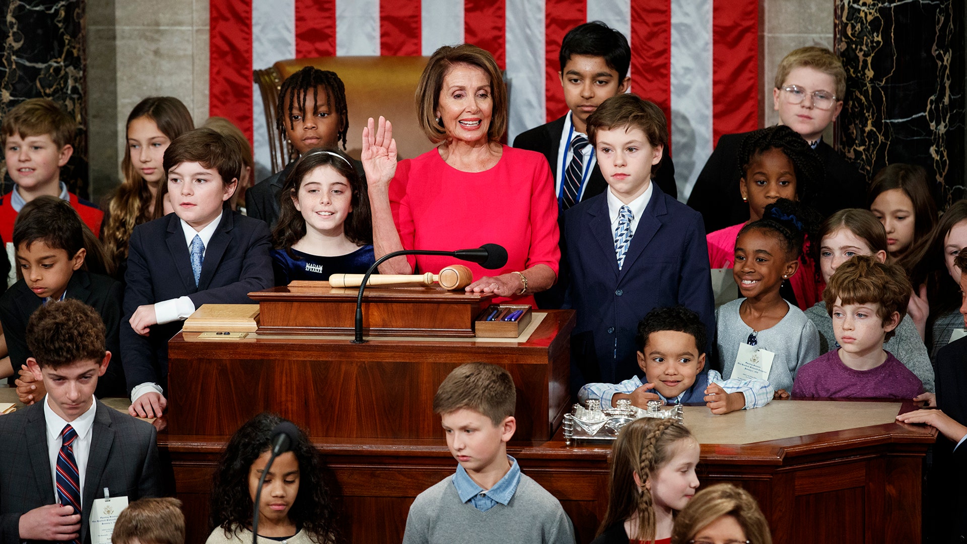Nancy Pelosi of California, surrounded by her grandchildren and children of representatives takes the oath to become Speaker of the House in Washington, Jan. 3, 2019. 