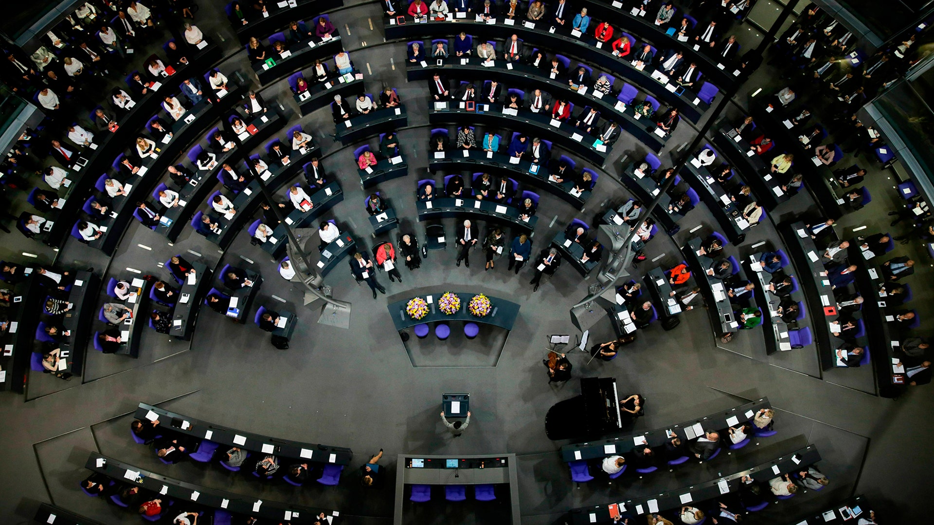 German lawmakers attend a special session of parliament at the Reichstag building, host of the German federal parliament, Bundestag, in Berlin, Germany, Jan. 17, 2019. 