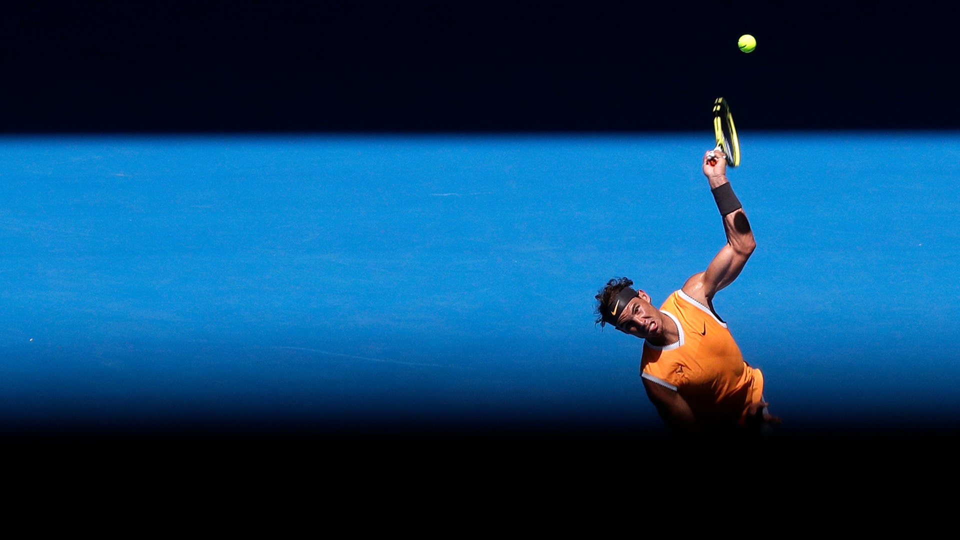 Spain's Rafael Nadal serves to Australia's James Duckworth in their first round match at the Australian Open tennis championships in Melbourne, Australia,  Jan. 14, 2019. 