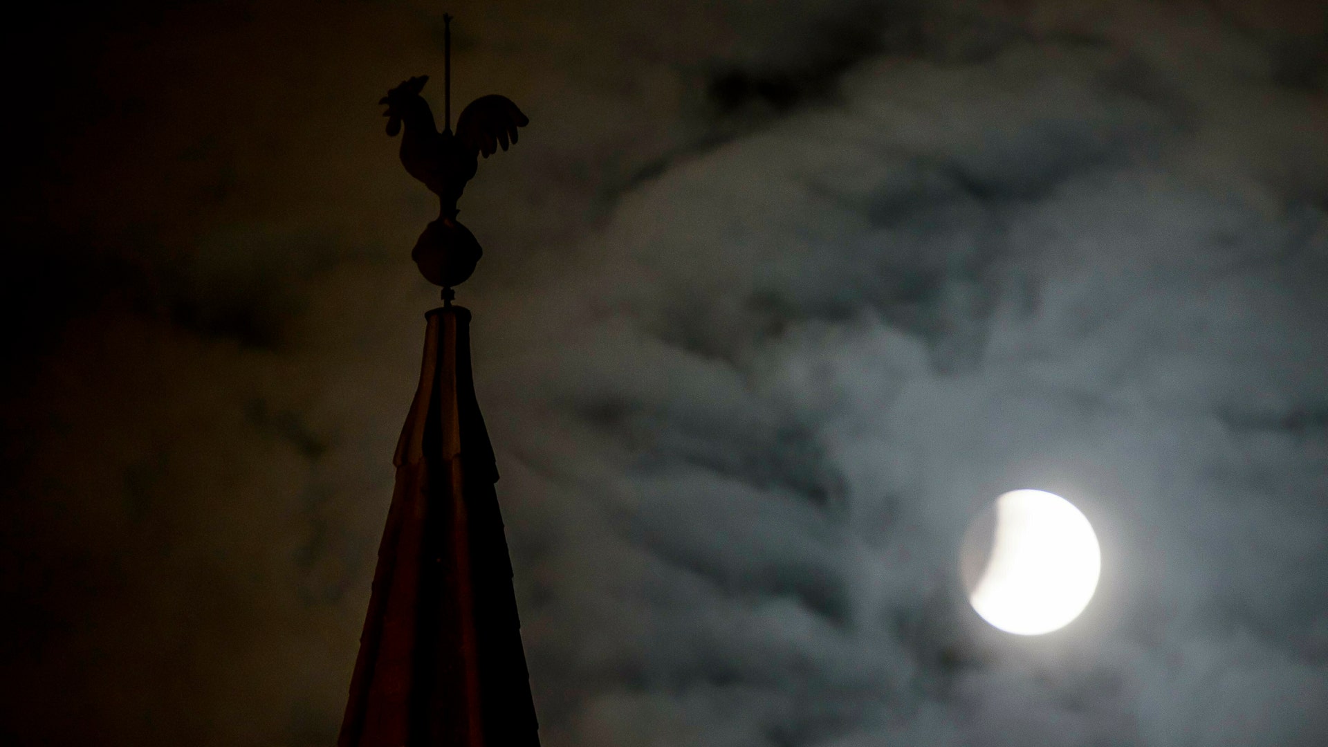 The eclipse was visible in parts of Europe. The moon fully shadowed by the Earth is seen next to a steeple during a total lunar eclipse in Salgotarjan, northeast of Budapest, Hungary, early Monday, Jan. 21, 2019.