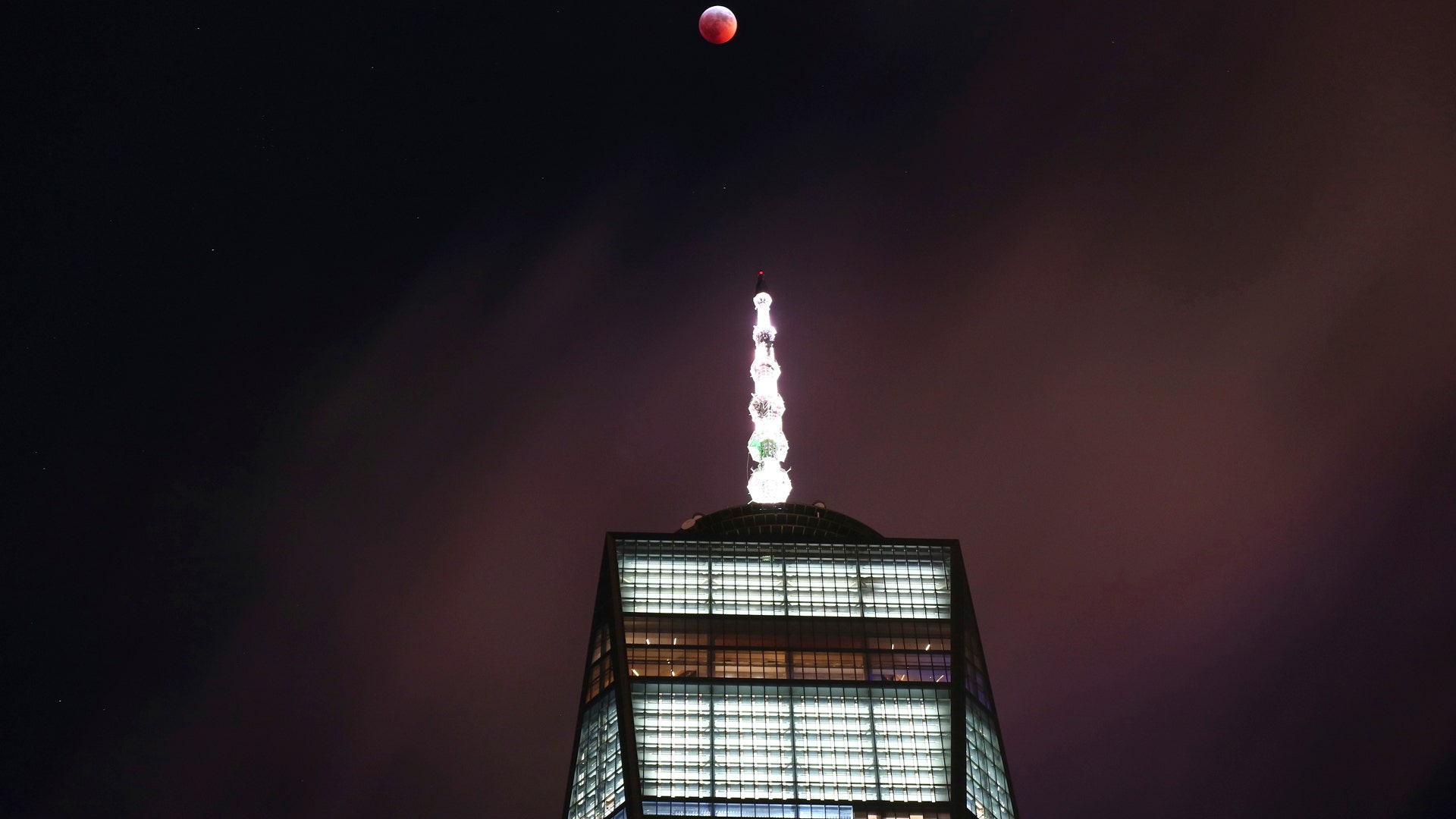 The super blood Moon visible above One World Trade Center in downtown Manhattan.
