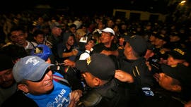 A rape suspect, a radio show host, and an immigration rights group are among those linked to organizing Central American caravans