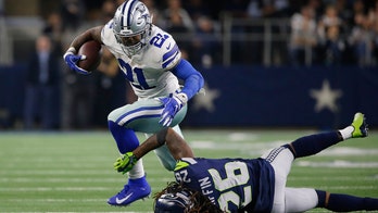Elliott, Cowboys power past Seahawks for 24-22 wild-card win