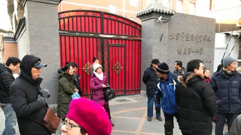 Hammer-wielding man attacks 20 children in Chinese primary school, officials say