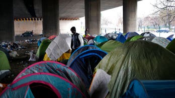 Thousands of migrants set up camps in Paris as authorities scramble to cope