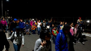 Thousands of caravan migrants request temporary asylum in Mexico; some try returning to US