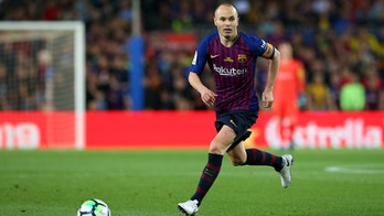 Spanish soccer star Andres Iniesta apologizes for blackface photo