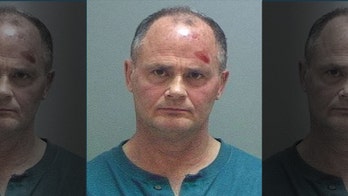 Unruly JetBlue passenger forces emergency landing, spits on arresting officer's face