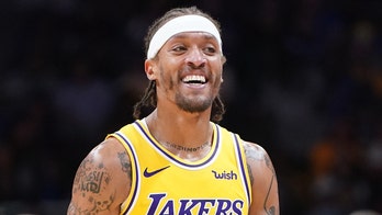 Los Angeles Lakers' Michael Beasley attempts to enter game with wrong shorts