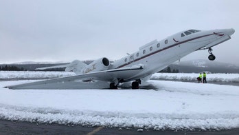 Heavy 'Sierra cement' snow causes jet to pop a wheelie as storm brings blizzard conditions to California