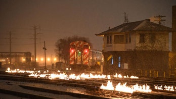 Polar vortex forces Chicago rail crews to use fire to keep trains moving