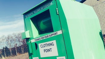 Woman dies after becoming stuck inside clothing bin, police say