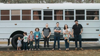 Family of nine travels the country in a converted school bus, 'unschools' kids on the road