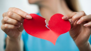 Man confronts cheating partner at airport with giant sign