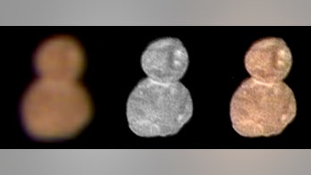 NASA says icy object past Pluto looks like reddish snowman