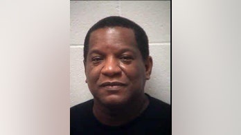 Former R. Kelly manager surrenders on terroristic threats charge