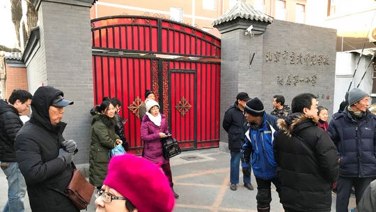 Hammer-wielding man attacks 20 children in Chinese primary school, officials say