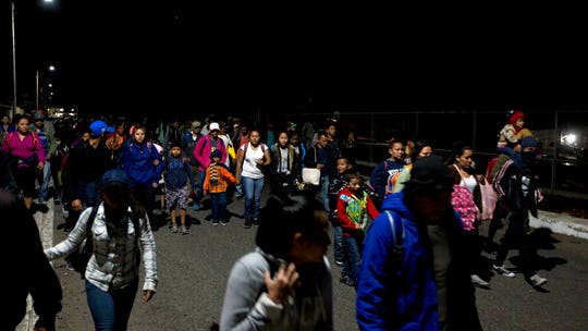 Thousands of caravan migrants request temporary asylum in Mexico; some try returning to US