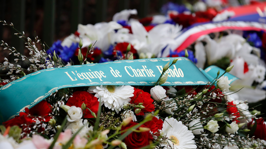 Paris honors attack victims at Charlie Hebdo, kosher market