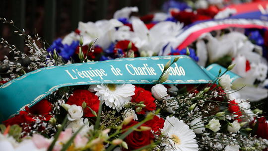 Paris honors attack victims at Charlie Hebdo, kosher market