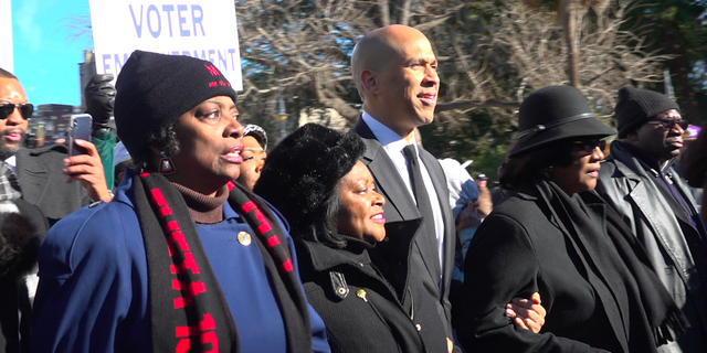 Sen. Cory Booker leads the march to South Carolina's State House on Martin Luther King Jr. Day.