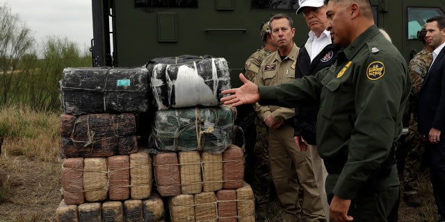 President Donald Trump tours the U.S. border with Mexico at the Rio Grande on the southern border, Thursday, Jan. 10, 2019, in McAllen, Texas.