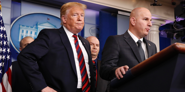 President Donald Trump, left, listens as Brandon Judd, president of the National Border Patrol Council, talks about border security, Thursday Jan. 3, 2019, after making a surprise visit to the press briefing room of the White House in Washington. (AP Photo/Jacquelyn Martin)