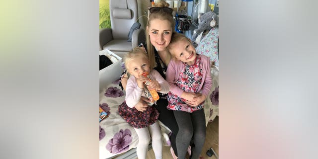 Brown, pictured with her two older children, said seeing her youngest babies take their first steps inspired her to learn how to walk using a prosthetic leg.