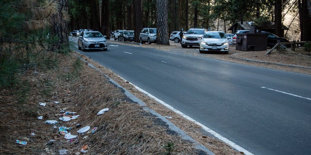 Trash is seen littering a roadside at Yosemite National Park, Calif.