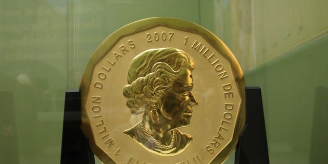 The Dec. 12, 2010 file photo shows the gold coin 'Big Maple Leaf' in the Bode Museum in Berlin. Four young men have gone on trial over the brazen theft of a 221-pound Canadian gold coin from a Berlin museum.