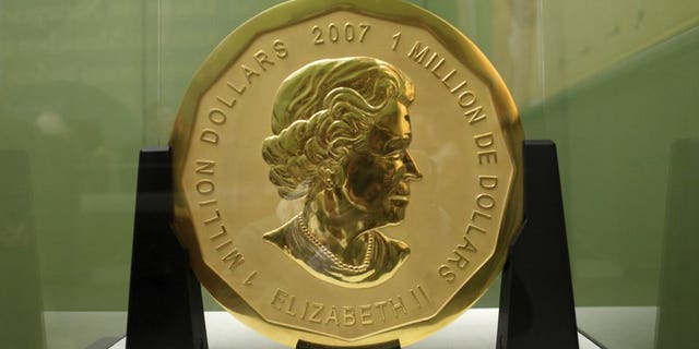 The Dec. 12, 2010 file photo shows the gold coin 'Big Maple Leaf' in the Bode Museum in Berlin. Four young men have gone on trial over the brazen theft of a 221-pound Canadian gold coin from a Berlin museum.