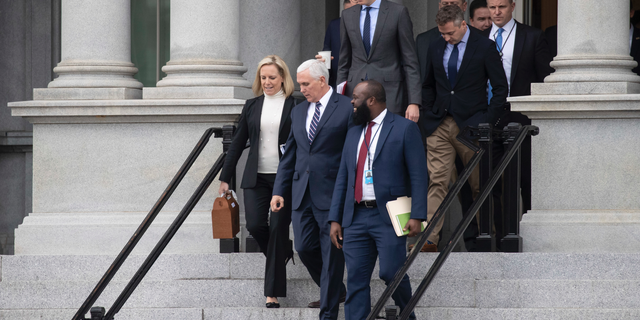 Homeland Security Secretary Kirstjen Nielsen, left, Vice President Mike Pence, White House legislative affairs aide Ja'Ron Smith, followed by White House Senior Adviser Jared Kushner, and others, leaving a meeting with staff members of House and Senate leadership Saturday in Washington. (AP Photo/Alex Brandon)