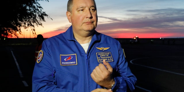 FILE - In this Thursday, Oct. 11, 2018 file photo, Director General of the Russia state corporation Roscosmos Dmitry Rogozin walks in Baikonur airport, in Kazakhstan.