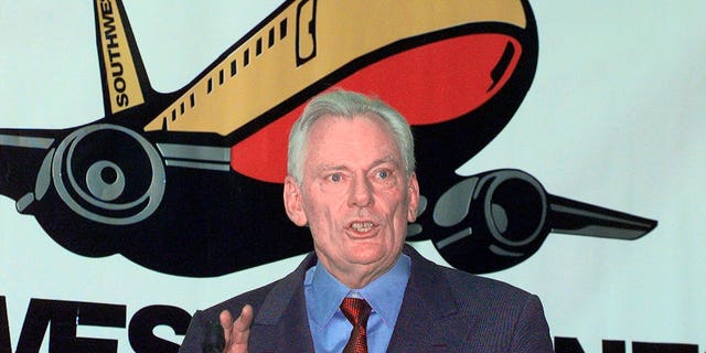 FILE - In this Dec. 9, 1998, file photo, Southwest Airlines President and CEO Herb Kelleher speaks at a news conference at MacArthur Airport in Islip, N.Y. Not many CEOs dress up as Elvis Presley, settle a business dispute with an arm-wrestling contest, or go on TV wearing a paper bag over their head. Southwest confirmed Kelleher died on Thursday, Jan. 3, 2019. He was 87. (AP Photo/Ed Betz, File)
