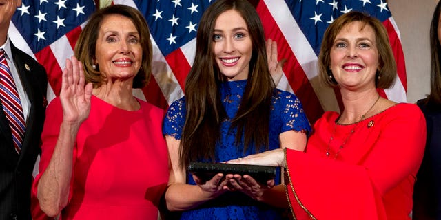 House Speaker Nancy Pelosi of Calif., administers the House oath of office to Rep. Kathy Anne Castor, D-Fla., during ceremonial swearing-in on Capitol Hill in Washington, Thursday, Jan. 3, 2019, during the opening session of the 116th Congress. (AP Photo/Jose Luis Magana)