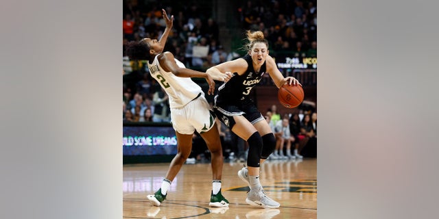 Connecticut guard/forward Katie Lou Samuelson (33) is fouled by Baylor guard Didi Richards (2) during the first half of an NCAA college basketball game on Thursday, Jan. 3, 2019, in Waco, Texas. (AP Photo/Ray Carlin)